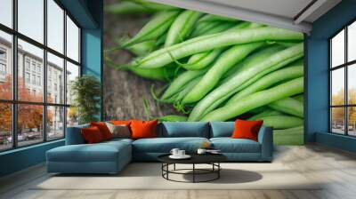 Bunch of organically grown 'Maxibel' French filet green beans harvested from a home garden on a rustic wooden table Wall mural