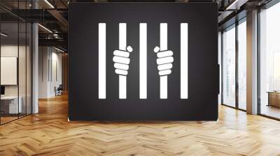 Prisoner hands behind bars simple icon on square background Wall mural