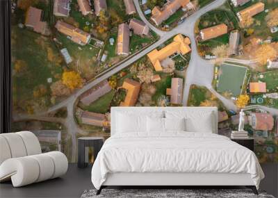 Aerial view of a small village.Top view of traditional housing estate in Czech. Looking straight down with a satellite image style.Houses from above, real estate concept.Country road urban scene Wall mural