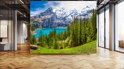 Amazing tourquise Oeschinnensee lake with waterfalls, wooden chalet and Swiss Alps, Berner Oberland, Switzerland Wall mural