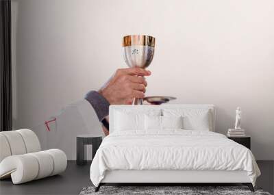 unrecognizable Priest holding the goblet during a wedding ceremony nuptial mass. Religion concept Wall mural