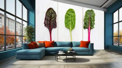 Three leaves of fresh swiss chard on a white table Wall mural