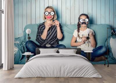 Mom and daughter with false mustaches Wall mural