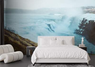 tourist visit stand on viewpoint gullfoss waterfall in iceland, cinematic beautiful majestic winter  Wall mural