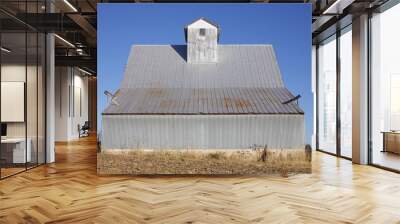 Old metal barn on a blue sky fall day Wall mural