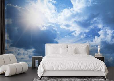 Bright blue sky background with white clouds and shining sun Wall mural