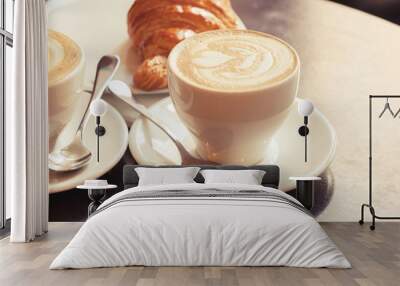 cappuccino with croissant. two cups of coffee on table Wall mural