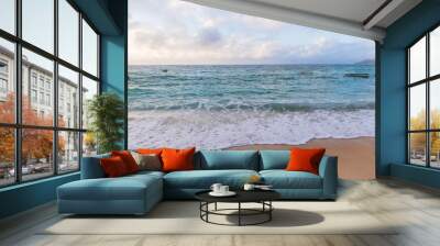 Coastal landscape with shore water under cloudy sky Wall mural