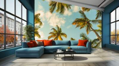 Coconut palm trees are under blue cloudy sky Wall mural