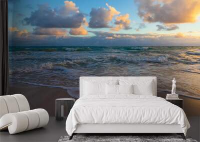 Colorful clouds and shore water on a sunrise Wall mural