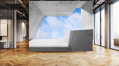 Concrete interior with blue cloudy sky Wall mural