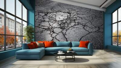 Dark asphalt road with cracks. Background texture Wall mural