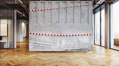 Texture of red and white striped tapes on concrete barrier Wall mural