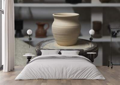 White clay pot stands on a pottery wheel, closeup Wall mural