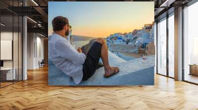 Man Enjoying Wine at Santorini Sunset Wall mural