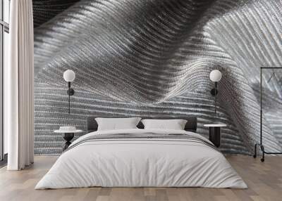 The silver fabric is laid out waves. Black and white canvas material textiles. Wall mural