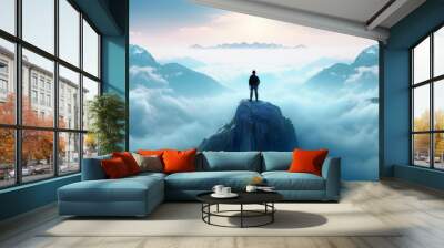 man standing on top of a mountain among mountains Wall mural