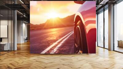 Red Car Driving at Sunset on Scenic Highway Wall mural