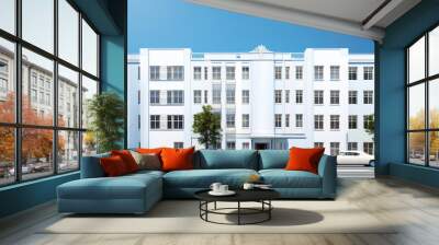 Stylish Urban Apartment Complex under Clear Blue Sky Wall mural