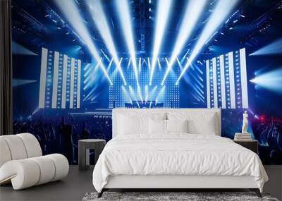 Electrifying Concert with Light Show and Enthusiastic Crowd Wall mural