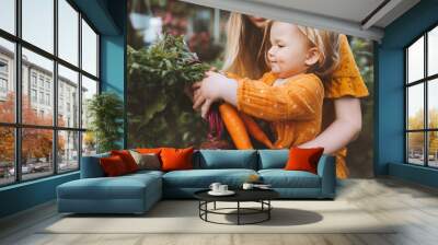 Family mother and child girl with organic vegetables healthy eating lifestyle vegan food homegrown carrot and beetroot local farming grocery shopping agriculture concept Wall mural