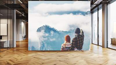 Happy Couple Man and Woman hugging enjoying mountains and clouds landscape on background Love and Travel emotions Lifestyle concept. Young family traveling active adventure vacations. rear view Wall mural