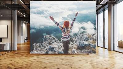 Happy woman traveler on mountain summit hands raised over clouds Travel Lifestyle success concept adventure active vacations outdoor harmony with nature Wall mural