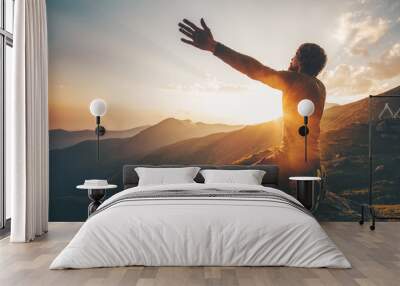 Man praying at sunset mountains raised hands Travel Lifestyle spiritual relaxation emotional concept vacations outdoor harmony with nature landscape Wall mural