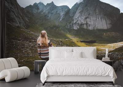 Woman hiking in mountains travel solo in Norway outdoor adventure active healthy lifestyle trip eco tourism trail Lofoten islands Wall mural