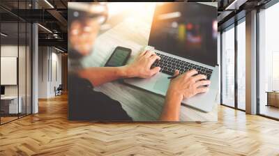 business man hand working on blank screen laptop computer and di Wall mural