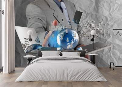 businessman shows modern technology with crumpled paper backgrou Wall mural