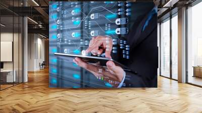 businessman  using tablet computer and server room background Wall mural