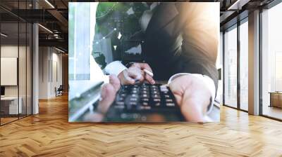 businessman working with calcurator and smart phone and laptop c Wall mural