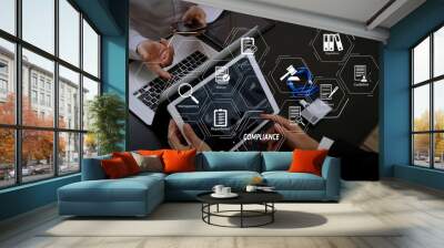 co working team meeting concept,businessman using smart phone and digital tablet and laptop computer and name tag in modern office Wall mural