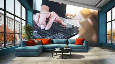 creative hand showing wood puzzle and smart phone with laptop co Wall mural