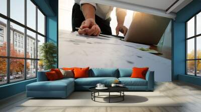 Double exposure of businessman hand working with new modern comp Wall mural