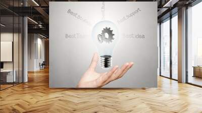 hand showing creative business strategy with light bulb as conce Wall mural