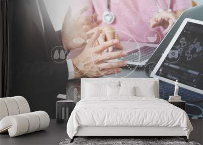 Medical co working concept,Doctor working with smart phone and digital tablet and laptop computer to meeting his team in modern office at hospital with virtual icon diagram Wall mural