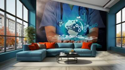 Medical Doctor holding a world globe in her hands as medical net Wall mural