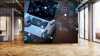 top view of Medicine doctor hand working with modern computer and blank screen on wooden desk as medical concept Wall mural