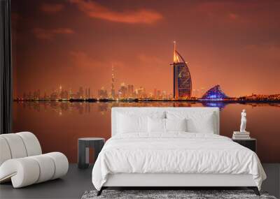 Beautiful skyline of Dubai city at night in United Arab Emirates Wall mural