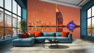 Beautiful skyline of Dubai city at night in United Arab Emirates Wall mural