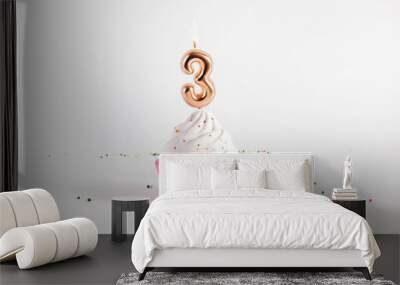 Birthday cupcake with number four candle on white background Wall mural