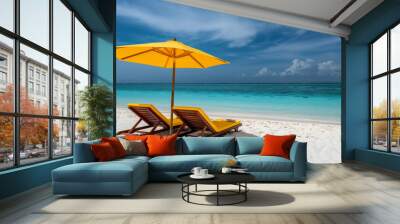 Two beach chairs and umbrella on the white sand of a Caribbean island with blue sea water in the background Wall mural