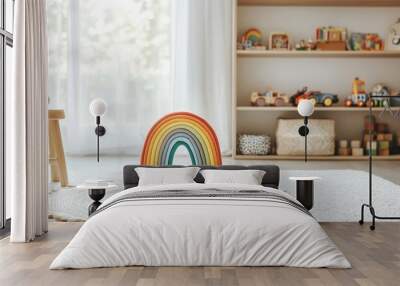 a modern children's room, with wooden shelves containing toys and a colorful rainbow toy. Wall mural