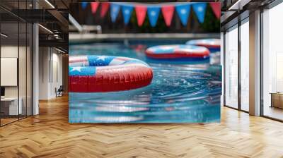 A pool decorated with American flag bunting and colorful pool floats creates a lively and inviting atmosphere for a festive celebration, capturing the spirit of summer and patriotism. Wall mural