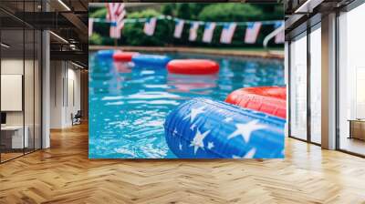 A pool decorated with American flag bunting and colorful pool floats creates a lively and inviting atmosphere for a festive celebration, capturing the spirit of summer and patriotism. Wall mural