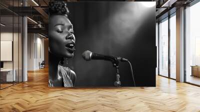 Black and white portrait of a female jazz singer performing passionately into a microphone with a spotlight above. Place for text. Wall mural