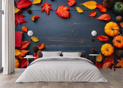 Autumn background, autumn aesthetics. Bright orange leaves, pumpkins, notepad on gray tabletop. Flatlay. Top view. Wall mural