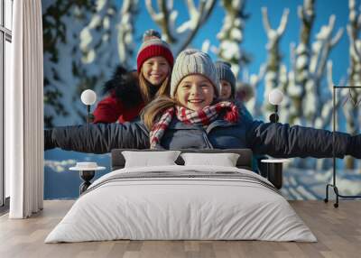 Joyful winter adventures: children sledding in the snow against the backdrop of tall pine trees in the snow. Winter joys. Childhood. Wall mural